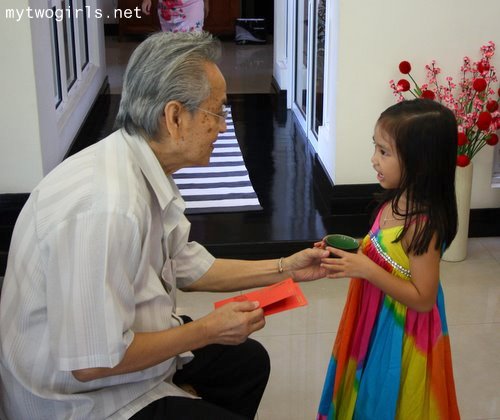 Zara serving tea to Ah Kong